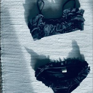 Black ruffled bathing suit.